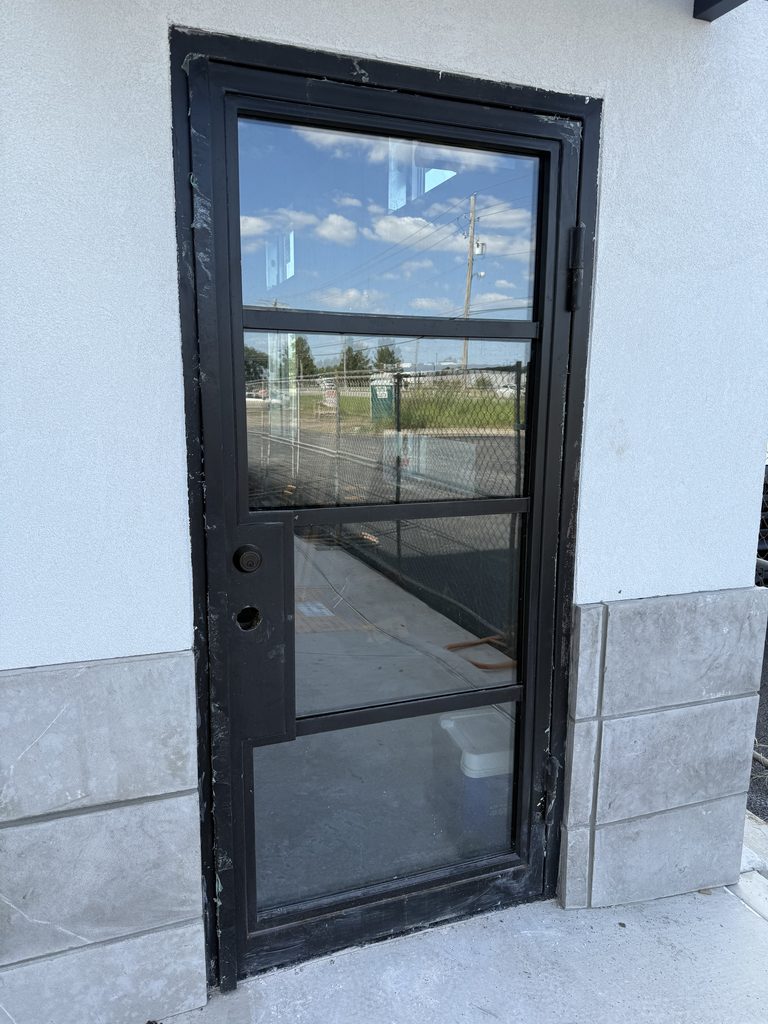 Bixby locksmith servicing commercial storefront door lock