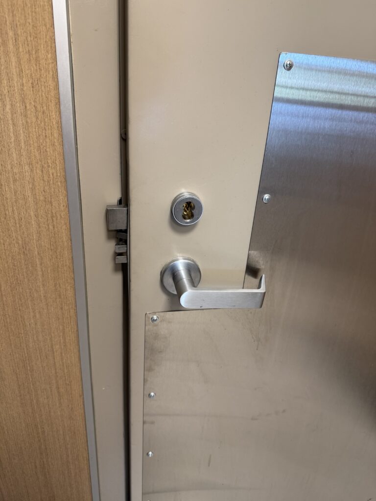 Door lock with an interchangeable core above a lever handle in Broken Arrow, Oklahoma