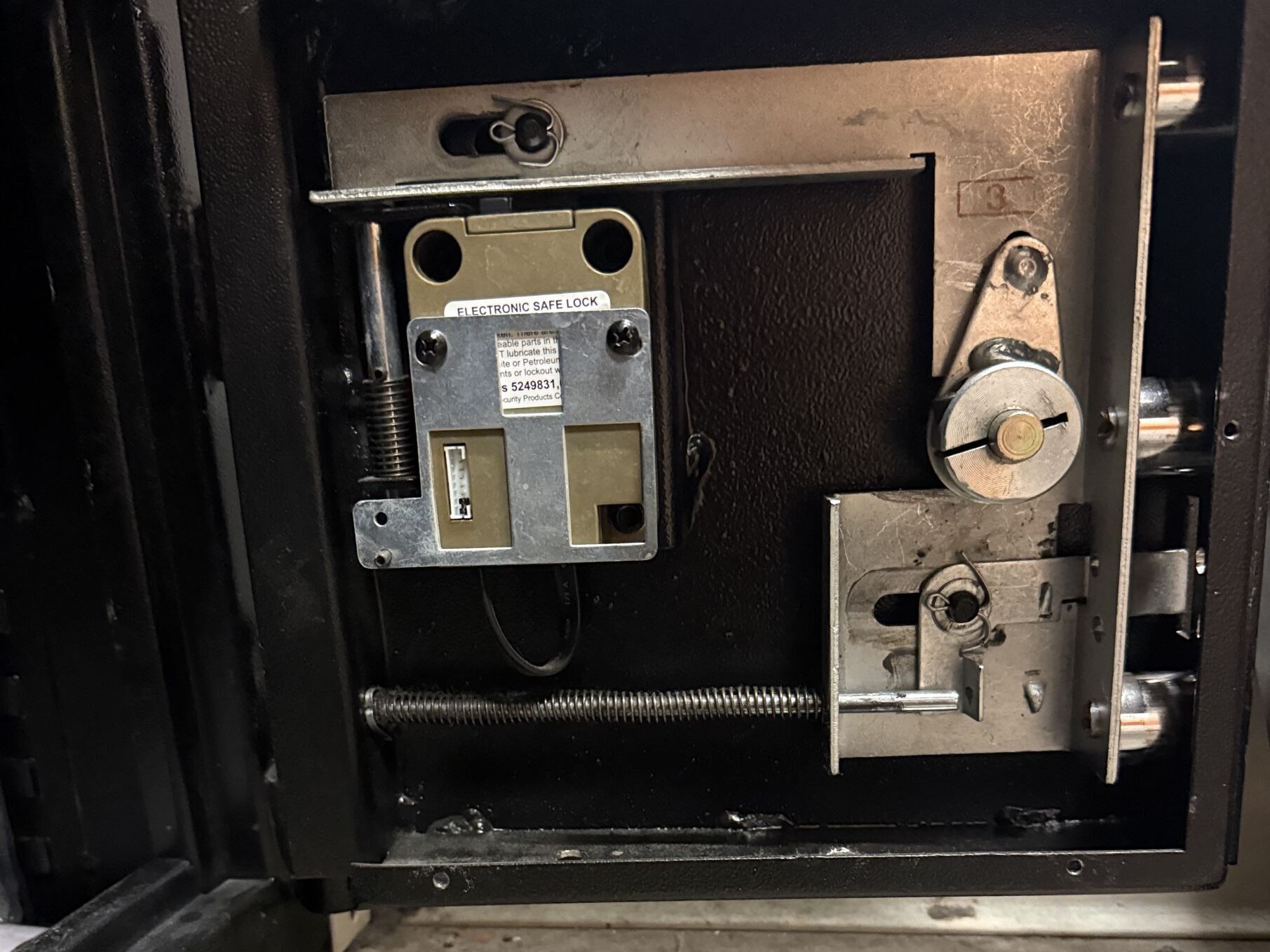 Safe lock and door mechanism being serviced by Fortress Lock & Safe