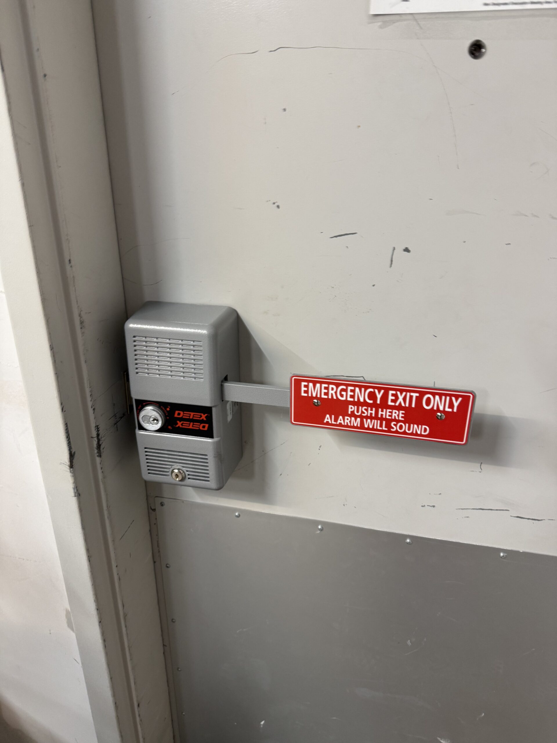 Detex exit alarm and pull handle on a commercial door after repair in Jenks