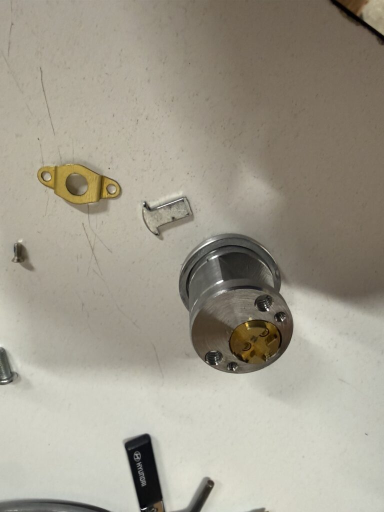 Key cylinder and tailpiece exposed during Detex exit alarm repair in Jenks