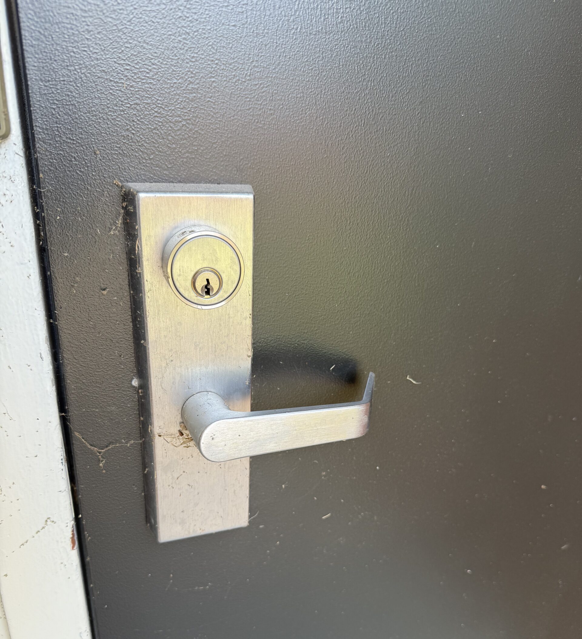 Commercial door lever and key cylinder serviced by Fortress Lock & Safe in Sand Springs